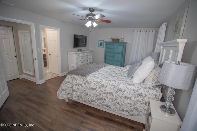 bedroom featuring dark wood-style flooring, ceiling fan, and baseboards