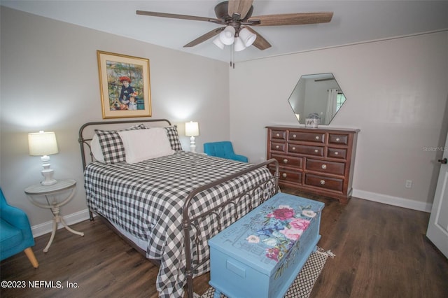 bedroom featuring ceiling fan, baseboards, and dark wood finished floors