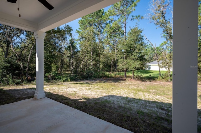 view of yard featuring a patio and ceiling fan