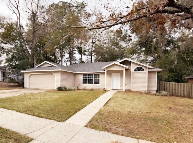 view of front of house with a garage and a front yard