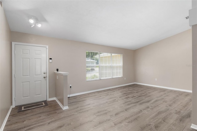 foyer with light hardwood / wood-style floors