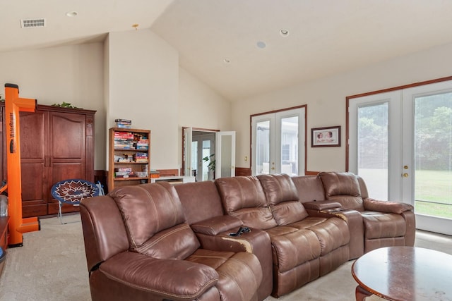 living room with light carpet, french doors, and lofted ceiling