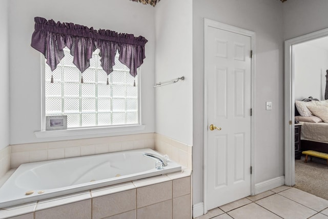 bathroom featuring tile patterned floors and tiled bath