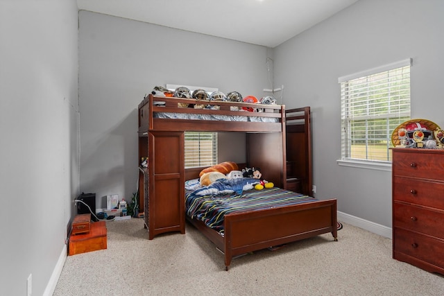 bedroom with light carpet