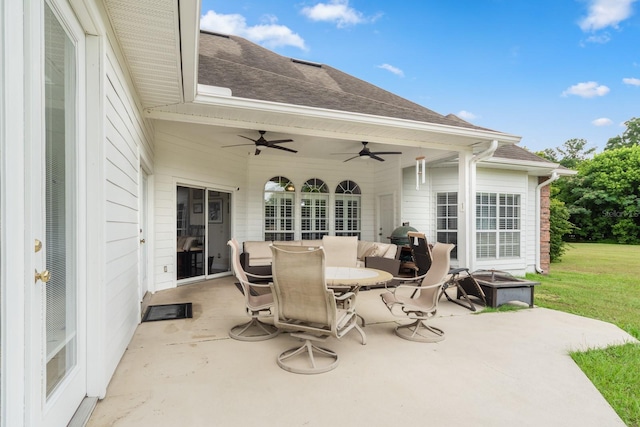 view of patio featuring ceiling fan