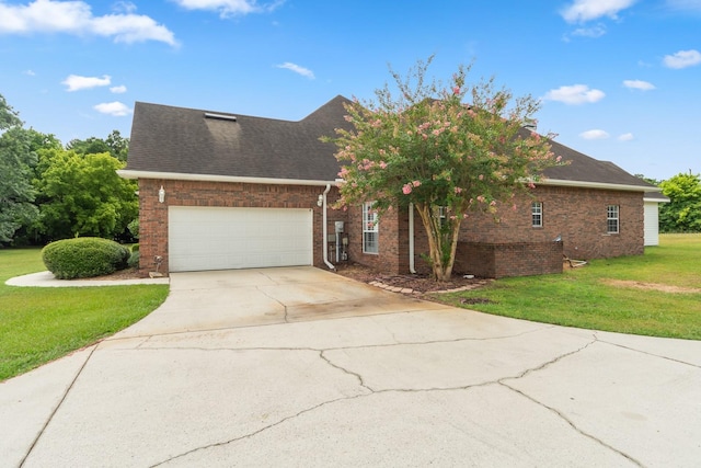 view of front of house featuring a garage and a front lawn