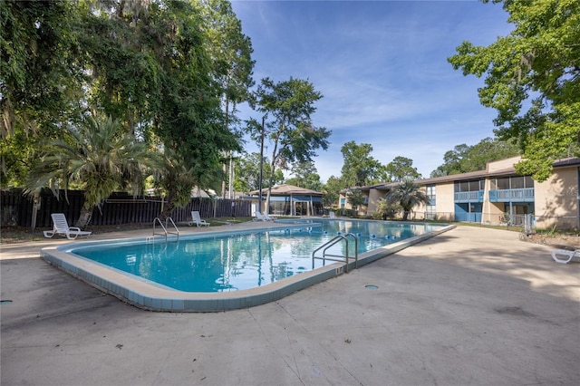 view of pool featuring a patio area