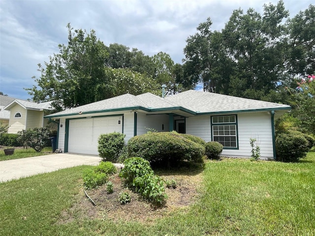 ranch-style house with a garage and a front lawn