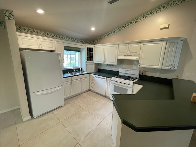 kitchen featuring light tile patterned flooring, lofted ceiling, sink, white cabinetry, and white appliances