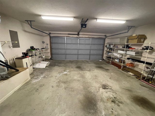 garage featuring a garage door opener and electric panel