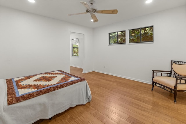 bedroom featuring wood-type flooring and ceiling fan