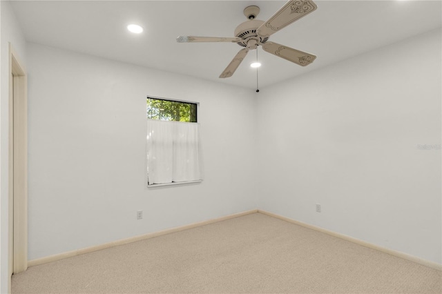 carpeted empty room with ceiling fan