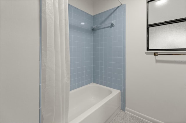 bathroom with shower / bathtub combination with curtain