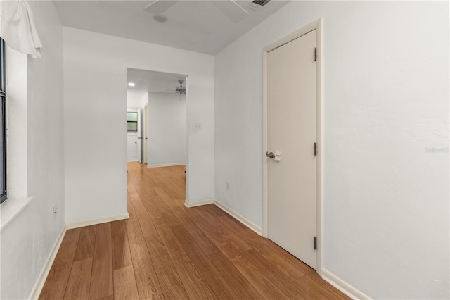 hallway with light wood-type flooring