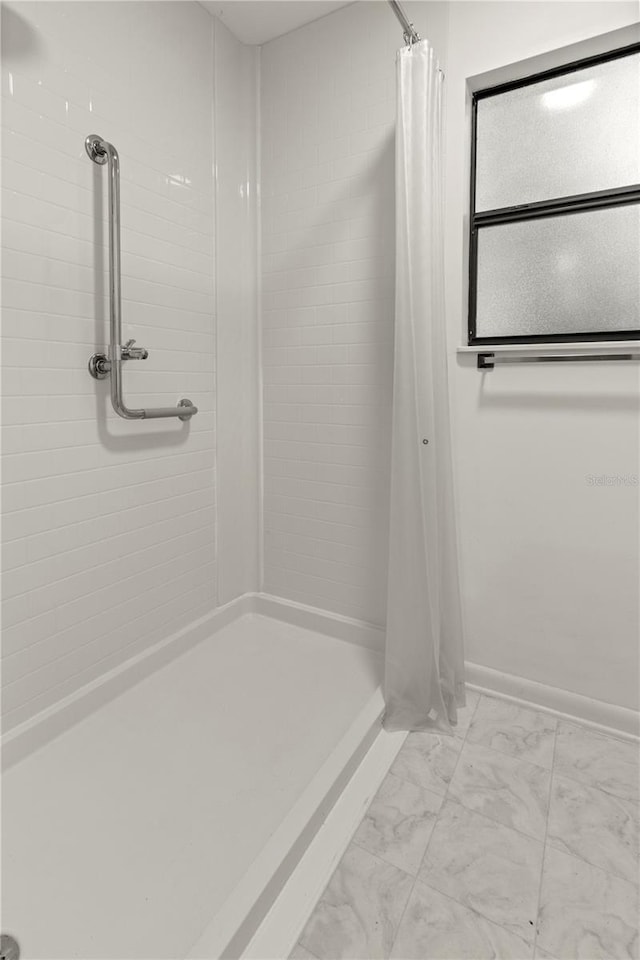 bathroom with a shower with curtain