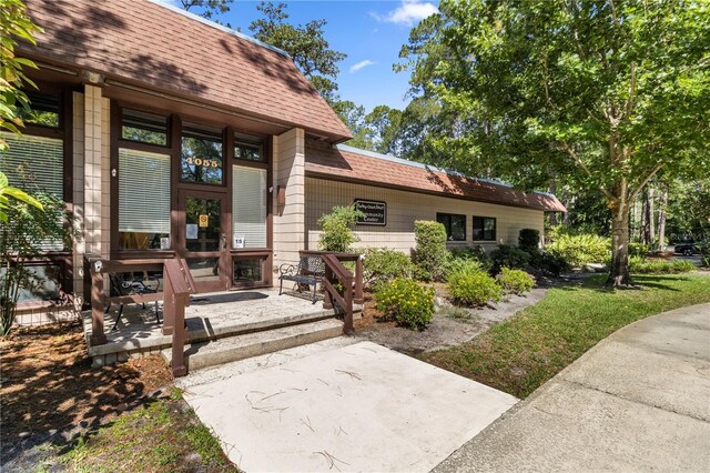 doorway to property with a patio area