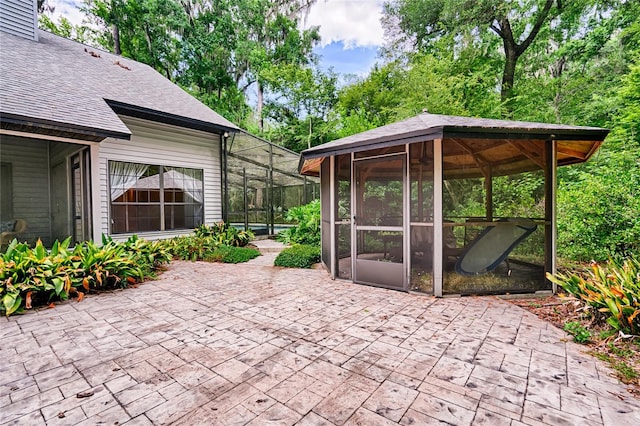 view of patio with a sunroom