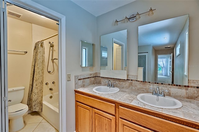 full bathroom featuring shower / tub combo with curtain, tile patterned flooring, vanity, and toilet