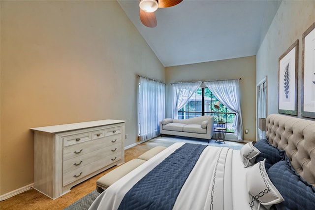 carpeted bedroom with high vaulted ceiling and ceiling fan