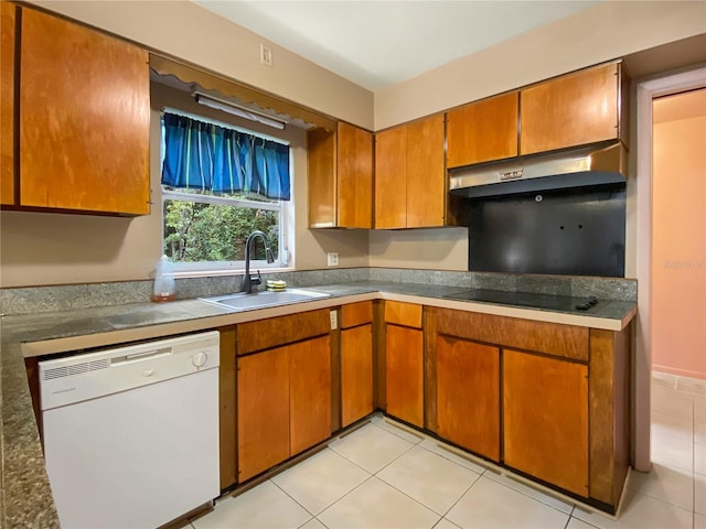 kitchen featuring sink, dishwasher, and light tile patterned floors