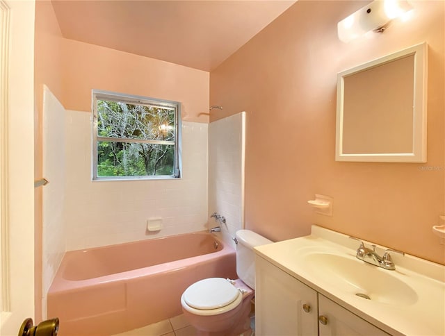 full bathroom featuring tile patterned flooring, toilet, vanity, and tiled shower / bath