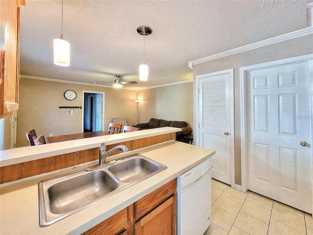 kitchen featuring sink, white dishwasher, pendant lighting, light tile patterned floors, and ornamental molding