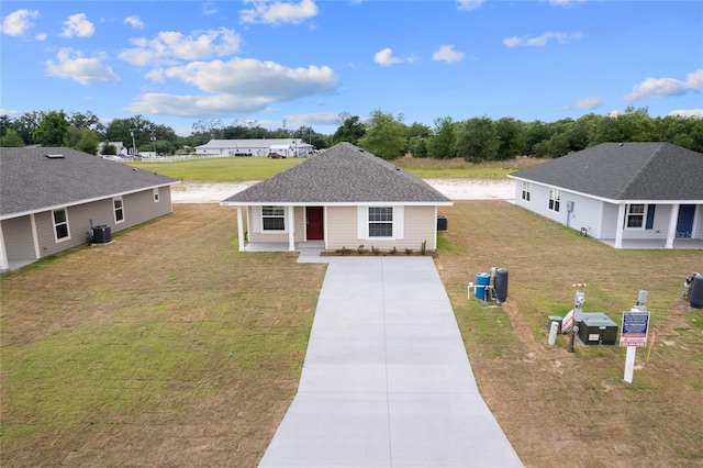 view of front of house featuring a front lawn, a porch, and central AC