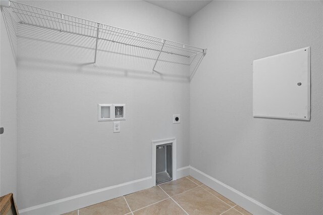 laundry area featuring hookup for an electric dryer, washer hookup, and tile patterned floors