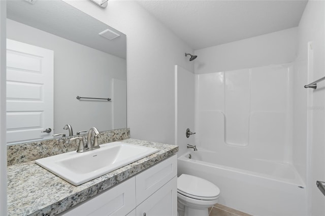 full bathroom with vanity, a textured ceiling, shower / bathing tub combination, tile patterned flooring, and toilet