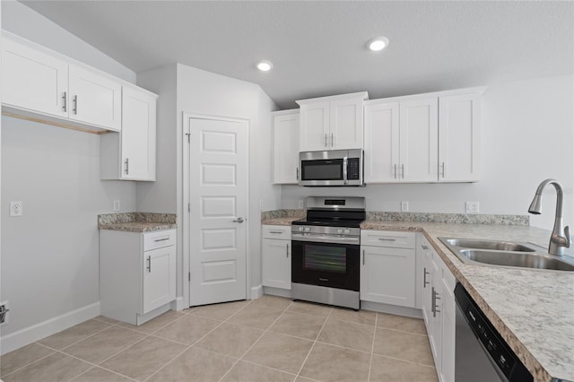 kitchen with white cabinets, sink, and appliances with stainless steel finishes