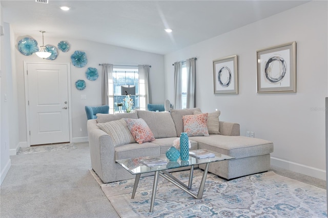 carpeted living room with lofted ceiling