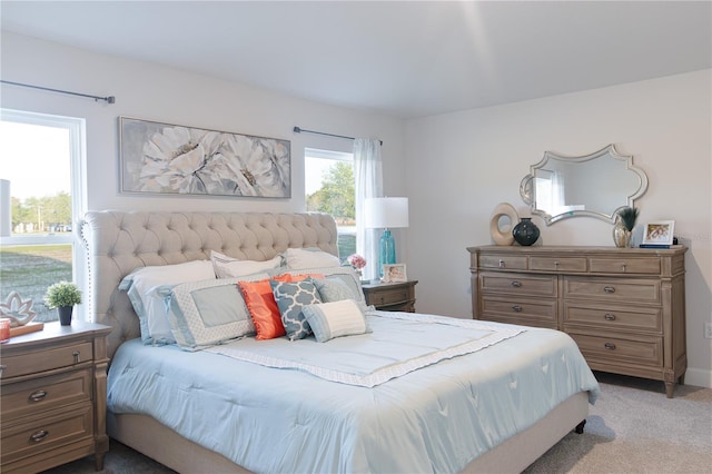 bedroom featuring light colored carpet