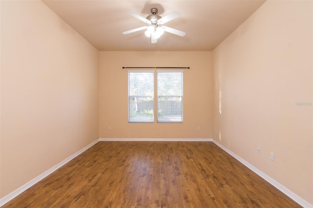 spare room with hardwood / wood-style floors and ceiling fan