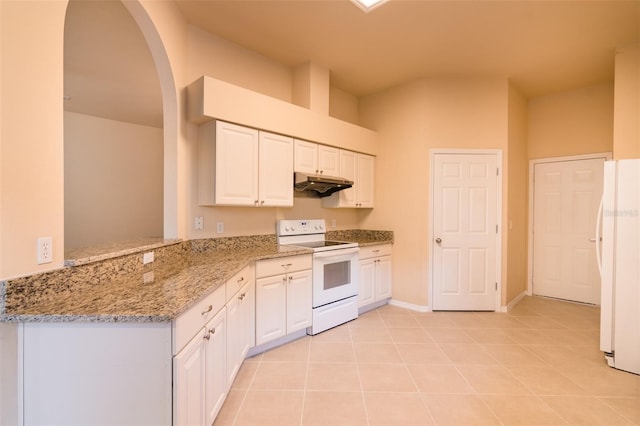 kitchen featuring white appliances, white cabinets, light stone countertops, light tile patterned flooring, and kitchen peninsula