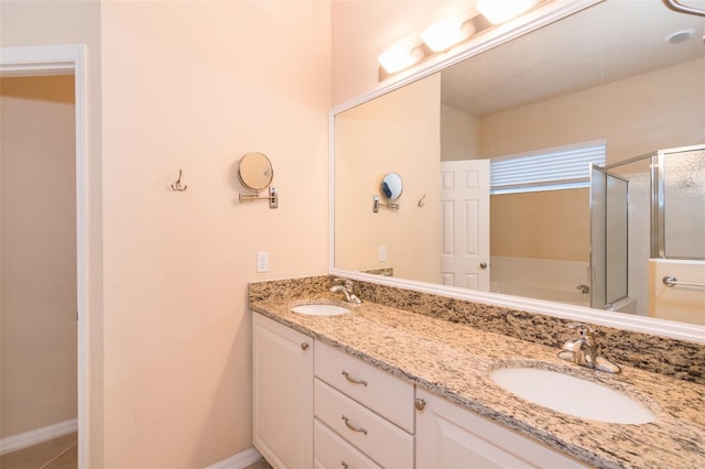 bathroom featuring shower with separate bathtub, vanity, and tile patterned floors