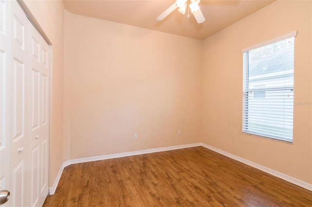 spare room with hardwood / wood-style floors, plenty of natural light, and ceiling fan