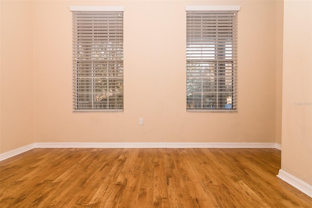 unfurnished room featuring wood-type flooring