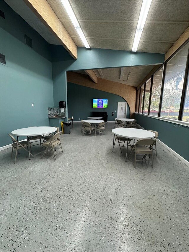 game room featuring speckled floor, baseboards, and visible vents