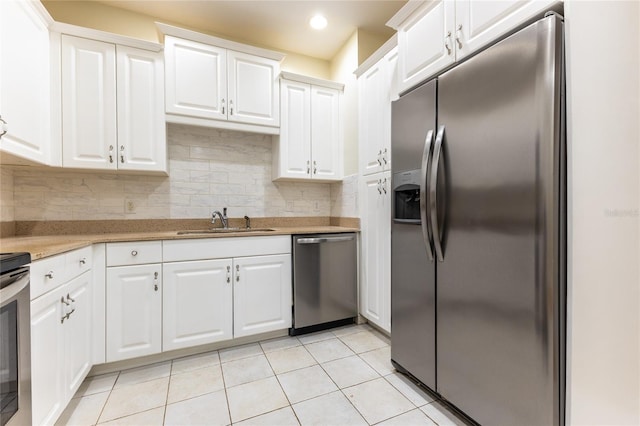 kitchen with white cabinetry, sink, and appliances with stainless steel finishes