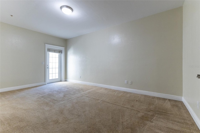 empty room with carpet flooring