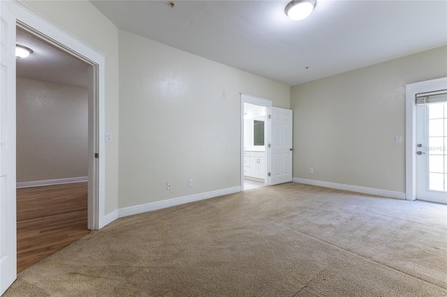 empty room with light colored carpet