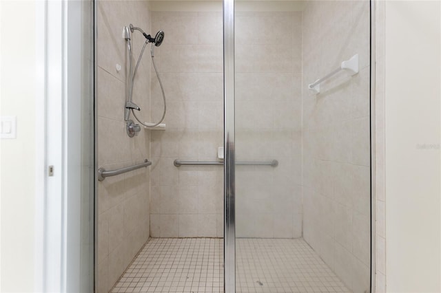 bathroom featuring a shower with door