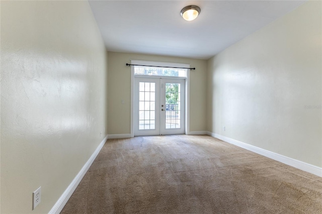 doorway to outside with french doors and carpet