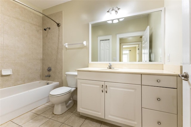 full bathroom with tile patterned floors, tiled shower / bath combo, toilet, and vanity