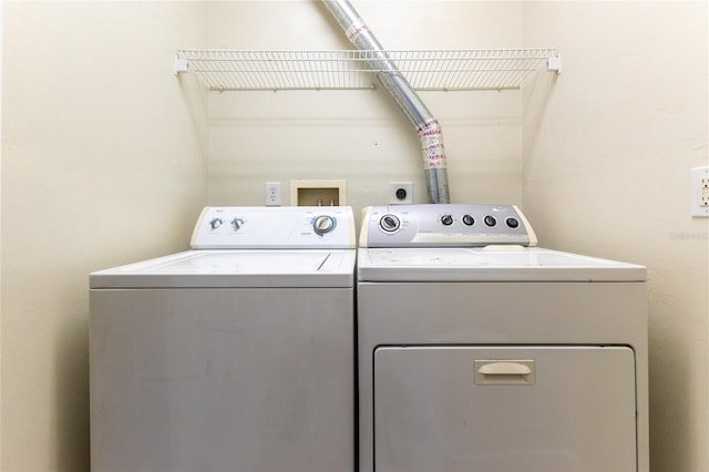 laundry area with separate washer and dryer