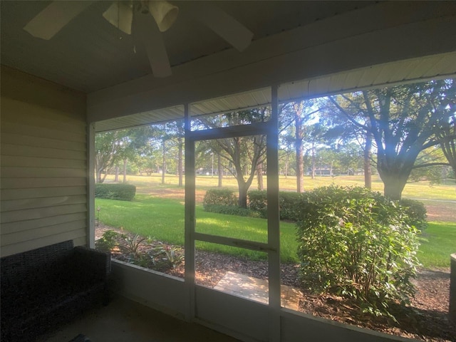 sunroom with a ceiling fan