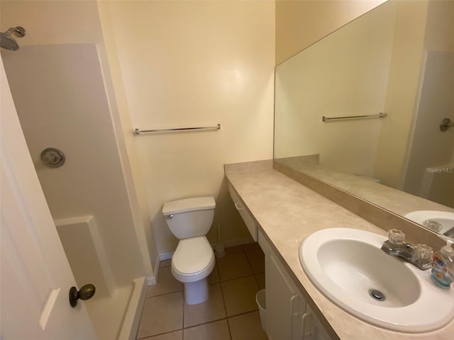 full bathroom featuring toilet, a shower, tile patterned flooring, and vanity
