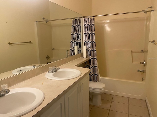 full bathroom with tile patterned floors, a sink, and shower / bath combo