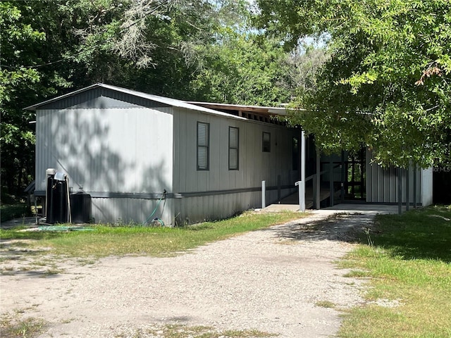 view of front of property featuring a carport