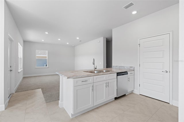 kitchen featuring white cabinetry, sink, stainless steel dishwasher, kitchen peninsula, and light carpet